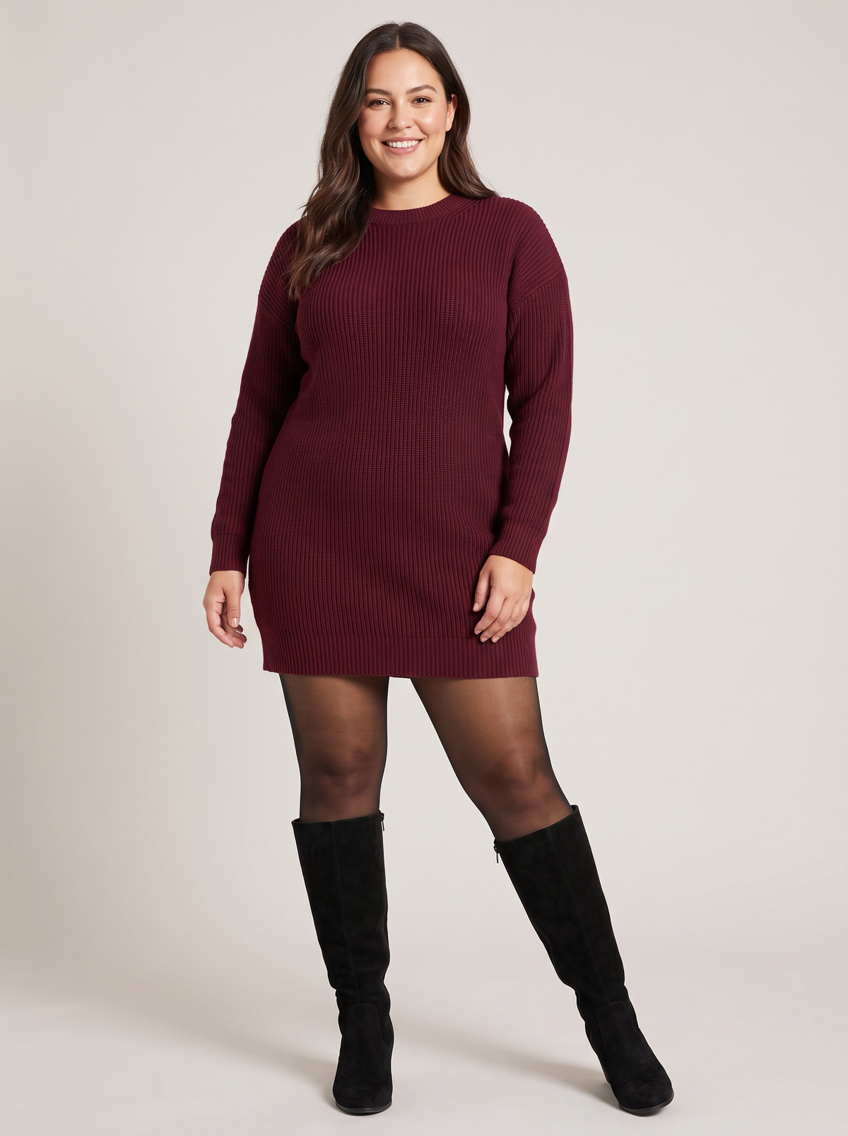 Plus-size model wearing black SheerSnug fleece-lined tights with a sweater dress